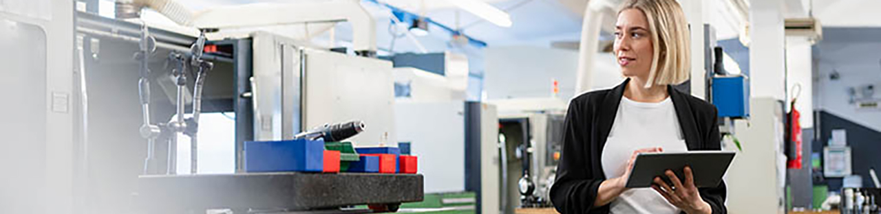 Woman with blond hair looking at equipment